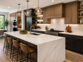 Modern kitchen countertop ideas featuring quartz countertops, waterfall island, natural wood cabinets, luxury kitchen design, and contemporary interior styling for 2026.